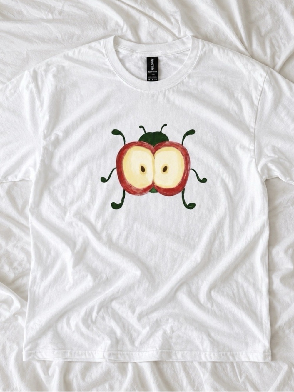 KWhite T-Shirt with Playful Apple Bug Graphic